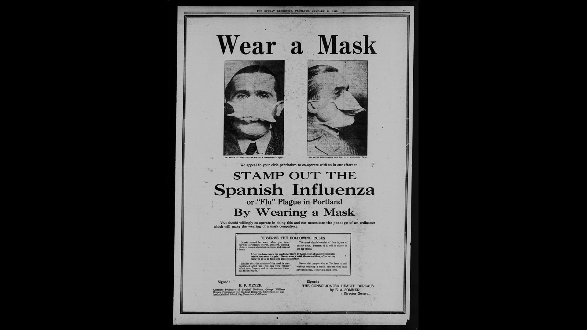 Black and white image of a "Wear A Mask" poster.